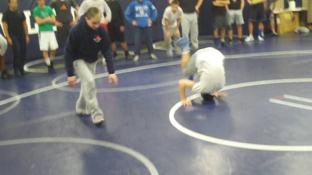 C:\Users\John\Desktop\Hewlett Wrestling Strength\pics\Wrestling Training Tips How to  Improve your  scrambles with Gymnastics Roll series Frame - 187.jpg